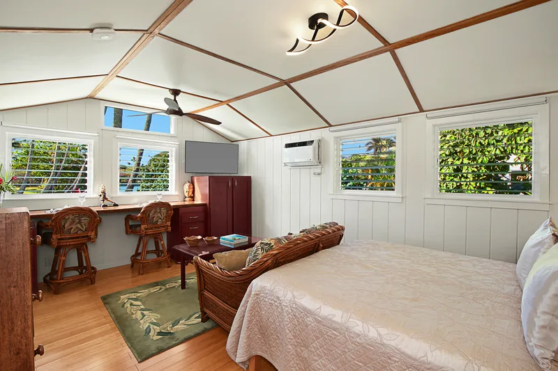 Bedroom with tropical decor at Fern Grotto Inn, Kapaa, Kauai