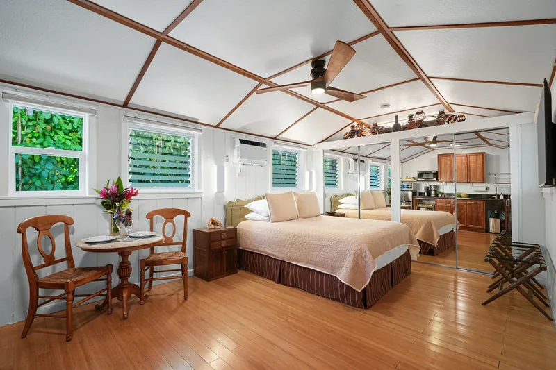 Bedroom with tropical decor at Fern Grotto Inn, Kapaa, Kauai