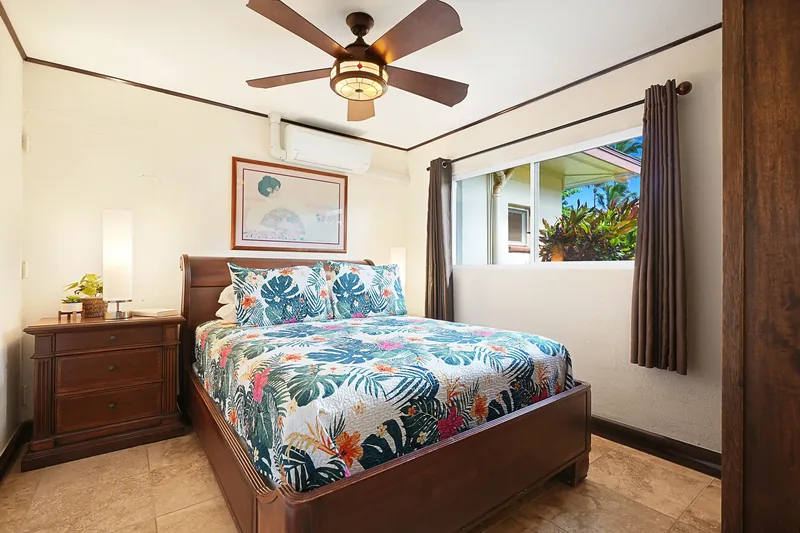Bedroom with tropical decor at Fern Grotto Inn, Kapaa, Kauai
