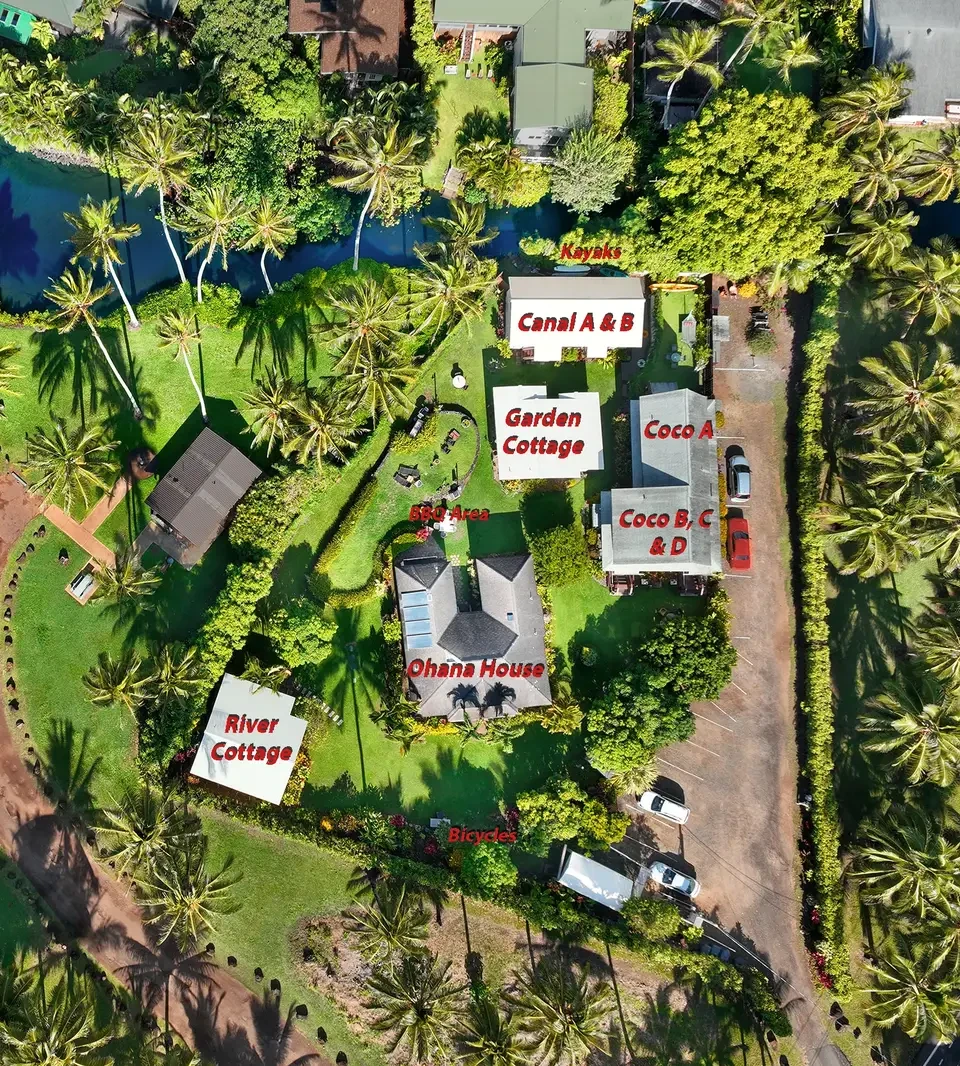 Aerial view of Fern Grotto Inn property showing all 9 cottages, parking area and driveway — Kapaa, Kauai